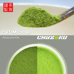 Spoonful of green matcha powder with a bowl of matcha tea, featuring 'OKUMIDORI' and 'Chazoku' branding.