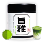 Matcha green tea powder canister with a glass of matcha and a scoop of powder on a white background