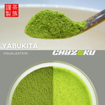 Spoonful of green matcha powder with a bowl of matcha below, featuring Yabukita and chazoku branding.
