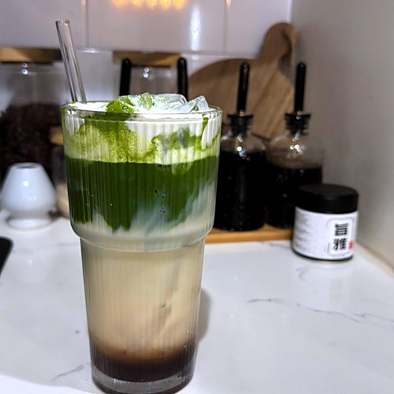 Customer photo: Beautiful layered latte with tin visible
